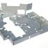 What is the role of the bending machine in the fabrication of automotive sheet metal parts?
